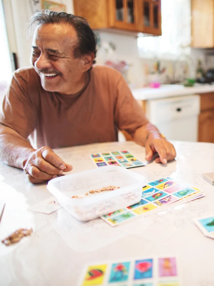 Man at kitchen table .webp