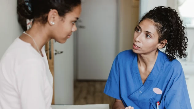 Doctor and young female patient.webp