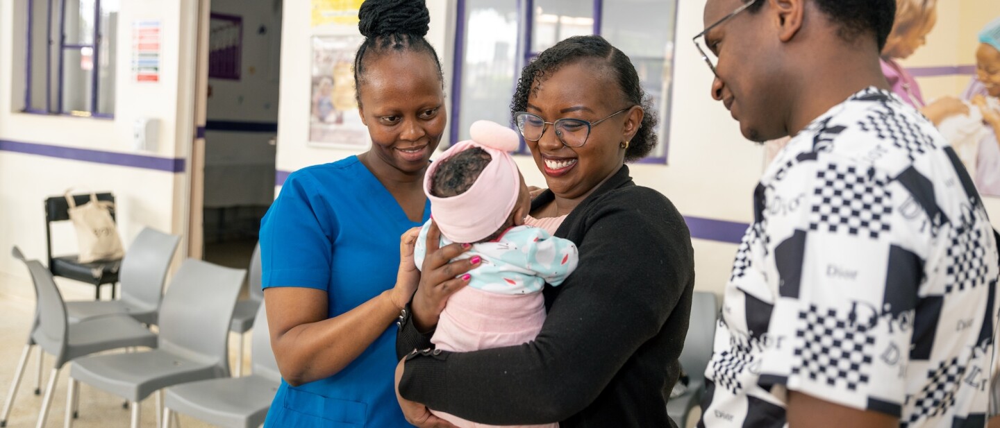 A couple and their child at Jacaranda Maternity