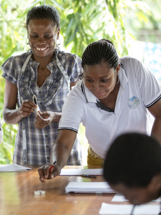 A group of students doing math in an outdoor classroom