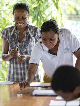 A group of students doing math in an outdoor classroom 