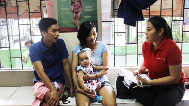 Annah Margarita Montesa meeting with a family in the Philippines