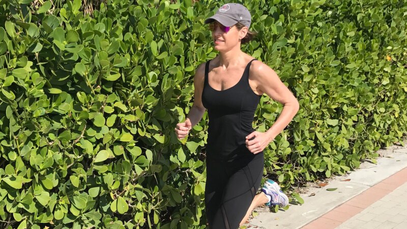 A photo of Cat Oyler running outside