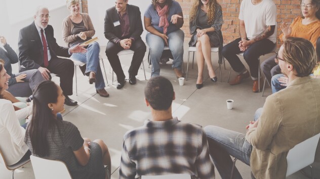group of attendees in conversation at HealtheVoices Conference