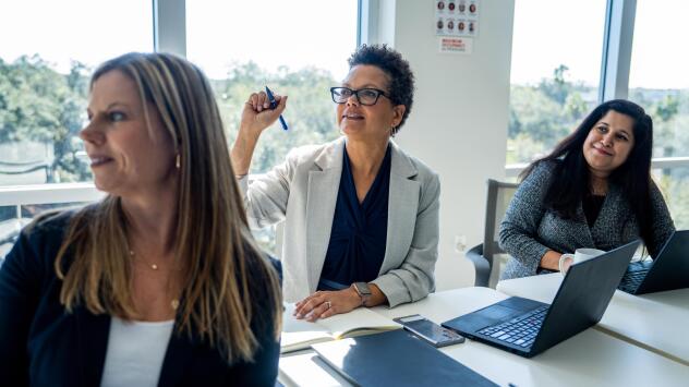 JJ_Photo_Woman with raised hand during meeting_JJ_1Star.jpg